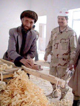 GI_inspects_an_Afghan_carpenters_work_at_Pol-e-Charkhi