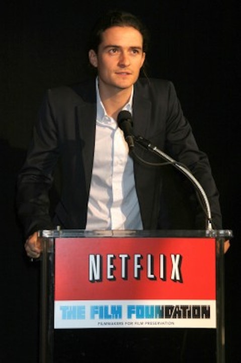 Netflix, Inc. (NASDAQ:NFLX), Sign, Logo, Brand, The Film Foundation, Orlando Bloom, red envelopes