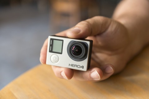 GoPro Inc (NASDAQ:GPRO), Camera, Hero 4, Hand holding, Isolated
