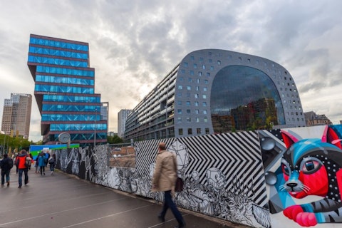 architecture, attraction, benelux, blaak, building, center, city, cityscape, commuter, construction, dawn, destination, europe, exterior, fence, food, futuristic, graffiti, hall, 11 Architectural Wonders That Seem To Defy Gravity