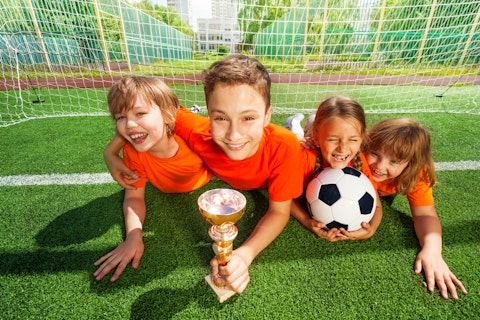 sport, child, gate, many, fun, park, green, row, boy, ball, arm, grass, goblet, football, group, childhood, uniform, game, net, prize, field, win, laying, lay, cup, active, summer,
