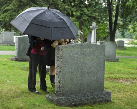 grave, umbrella, stone, rain, dead, children, bear, young, site, wet, tomb, cemetary, cemetery, flowers, trees, funeral, teddy, grass, outside, people, black, female, buried, 7 Ways to Save on Funeral Costs