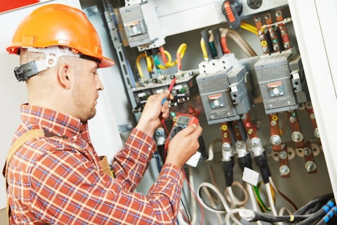 electrician working with meter