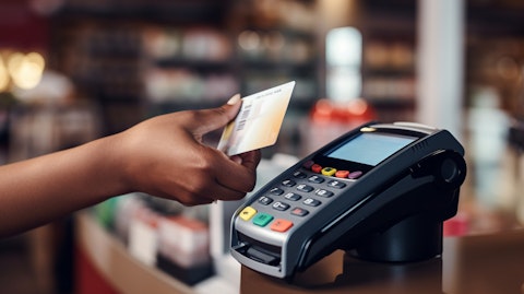 A woman using a payment terminal at the checkout of a store showing payment products and solutions.