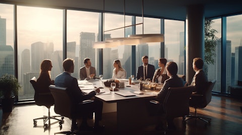 A group of business people discussing plans around a boardroom table adorned with a financial services company logo.