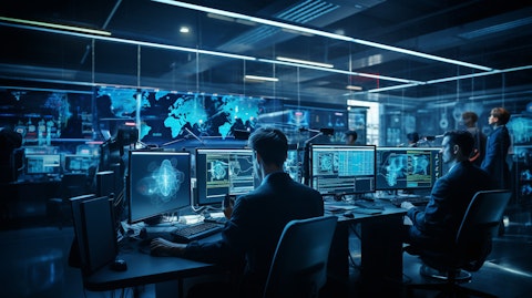 A cutting-edge computer lab full of IT experts monitoring the security of multiple systems.