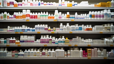 A pharmacy shelves stocked with pharmaceutical drugs awaiting distribution.