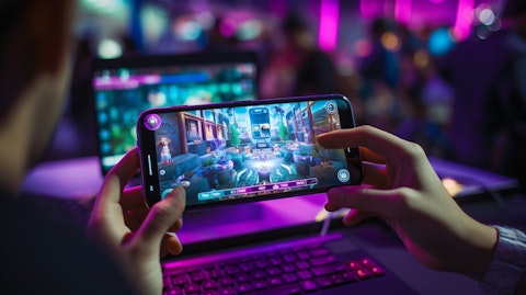 A person livestreaming their gameplay on a mobile device with integrated payment options.