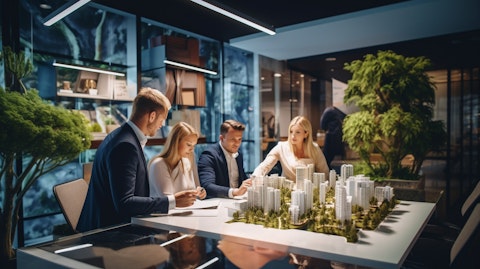 A team of real estate agents trading tips and tricks in a modern office, representing markets across the country.