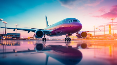 A shot of a commercial plane with a blur of color in the background, representing the production of auxiliary power units in the Safety and Productivity Solutions segment.