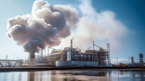 Close-up of a liquefied natural gas terminal expelling plumes of smoke.