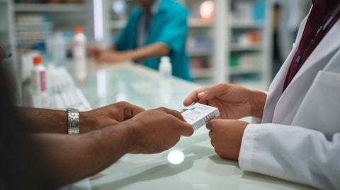 A pharmacist delivering a specific medication to a patient in a specialty pharmacy.
