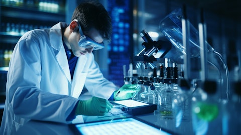 A biomedical scientist in a lab coat conducting research on biopharmaceutical compounds.