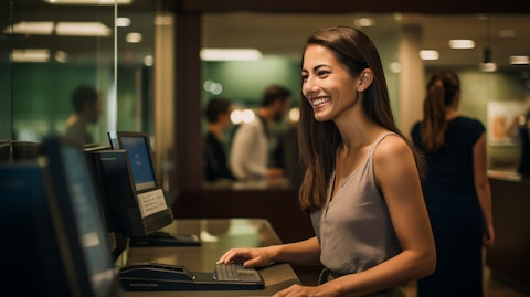 A smiling face of a customer as they make a deposit at this company's branch.