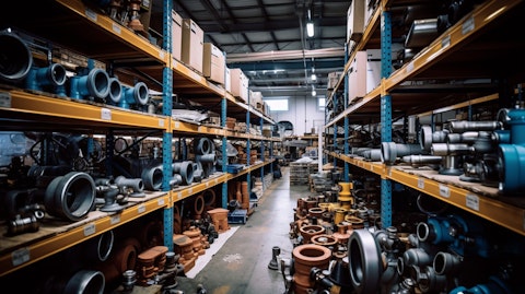 A busy warehouse stocked with a variety of industrial plumbing parts.