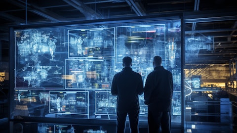 Engineers analyzing a complex network of process control software and systems.