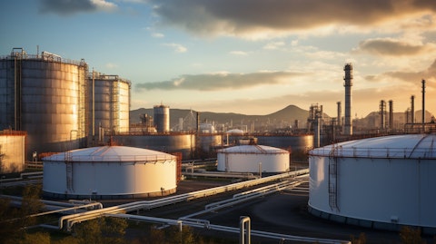 Massive storage tanks filled with crude oil and diesel fuels at an oil refinery.