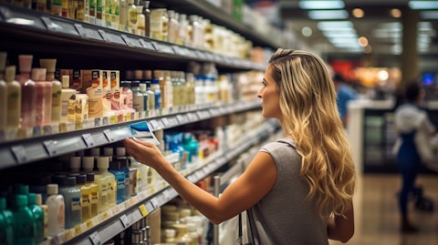 A female customer browsing a variety of body care products in a retail store.