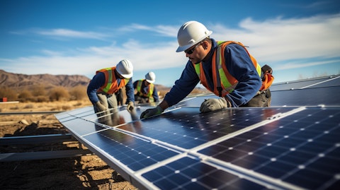 Solar panel workers installing a new farm for clean energy generation.