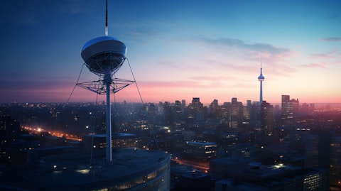 The corporate headquarters of a satellite radio systems company, illuminating the skyline.