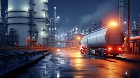 A tanker truck making its way through a refinery facility. .