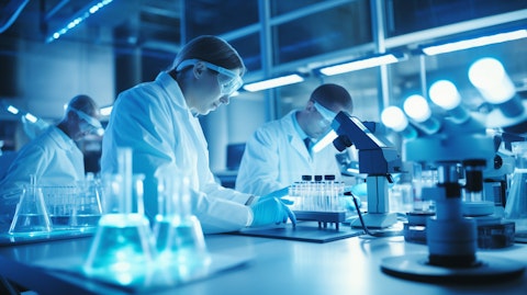 A team of scientists in a laboratory, running tests on a biotechnology product.