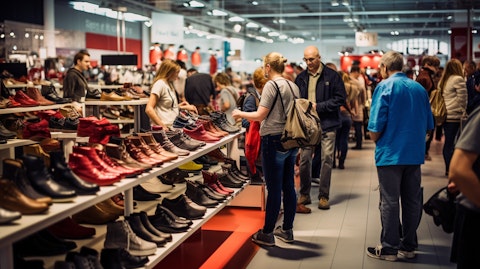A busy retail store full of customers trying on a wide range of footwear.