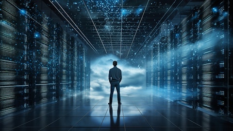 An employee standing in front of a large data center, looking toward the future of cloud security.