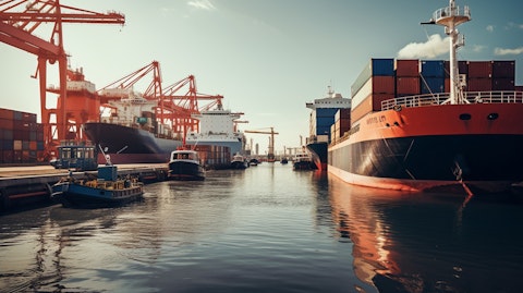 A large tanker ship and manys small boats at a port, illustrating the vast maritime activities of the company.