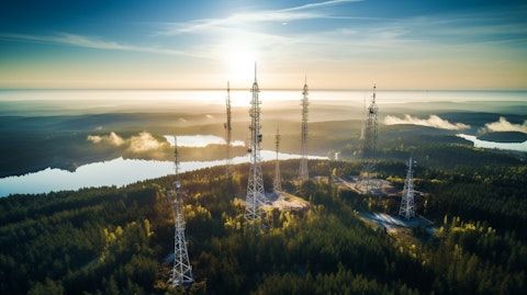 Aerial view of tall antenna towers and the landscape around them.