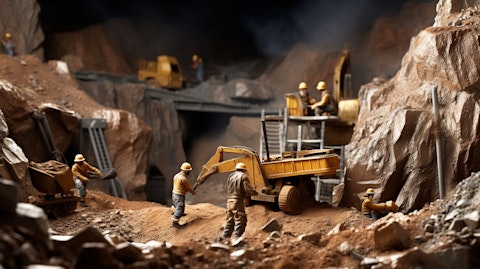 A macro view of a gold mine, with miners hard at work in the foreground.