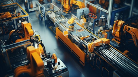 Aerial view of automated industrial machines at a modern factory floor, showcasing the company's innovative machinery.