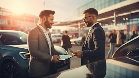 A customer buying a used car with the help of a finance specialist.