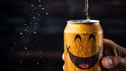 A hand pouring a cool can of a carbonated non-alcoholic beverage with a smiley face on it.