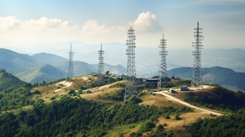 A close-up of an array of cell towers on a distant hilltop.