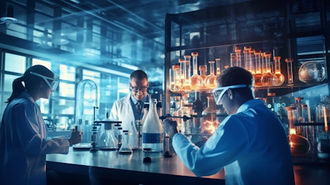 A team of scientists in a laboratory observing the sophisticated engineering of specialty chemicals.