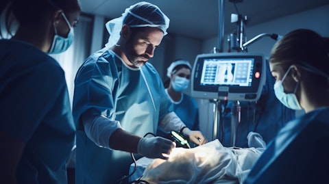 A team of doctors and nurses in the operating room, utilizing a variety of Masimo's medical technology.