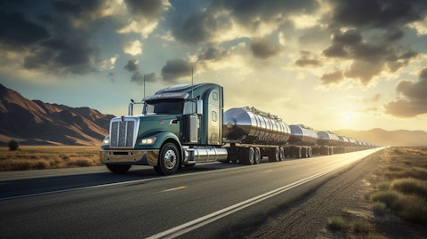 A fleet of tanker trucks transporting oil and natural gas, amidst the backdrop of open fields.