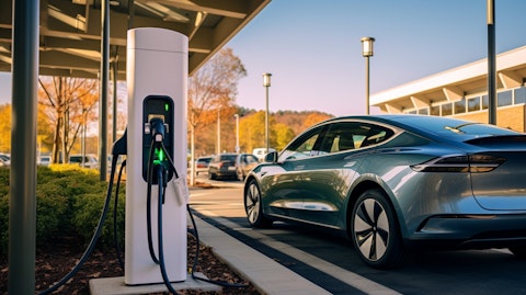 A state-of-the-art electric vehicle charging at a station at a suburban mall.