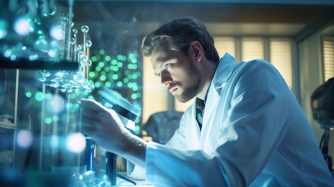 A medical scientist in a lab coat gazing at a microscopic view of a drug in development.