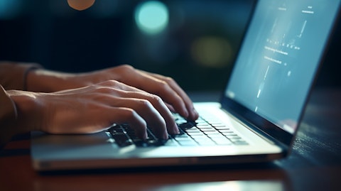 A close-up of hands typing on a laptop, highlighting the company's digital content.
