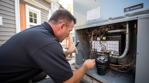 A worker inspecting a newly installed heating unit in a modern home.