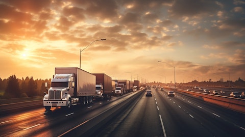 A convoy of freight trucks on a highway, reflecting industrial freight transportation.
