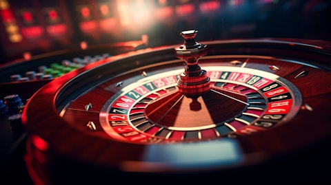 A close-up of a roulette wheel in a luxurious casino.