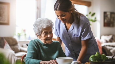 A home health aide helping an elderly person with their daily activities.