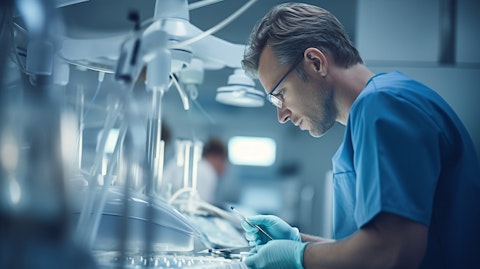 A doctor adjusting dental equipment in a modern dental clinic.