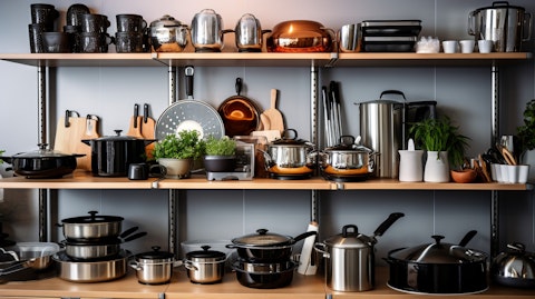 An interior of a modern home with a wide selection of cookware, tools and cutlery on display.