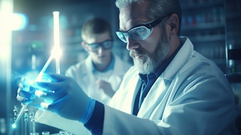 A clinician in a lab coat administering a trial of a biopharmaceutical product to a patient with an inflammatory disease.