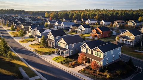 An elevated view of a suburban neighborhood of newly built attached single-family residential homes.