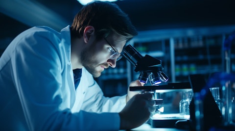 A scientist peering into a microscope, exploring innovative diagnostics techniques.